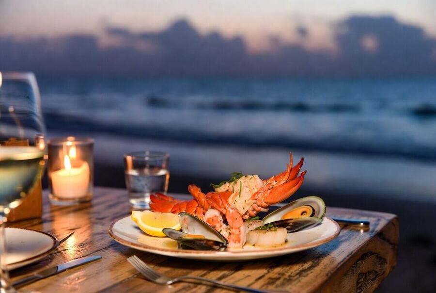 Gourmet seafood dinner at beachfront restaurant